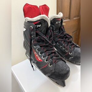 CCM Men's Black and Red Ice Skates
